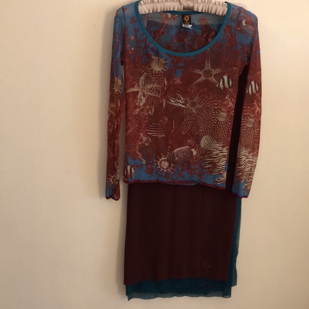 Suit. Made in Italy. Very light top with a long sleeve